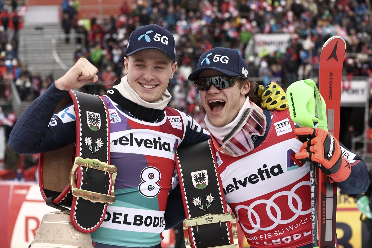 Norway's Lucas Braathen, right, winner of an alpine ski, men's World Cup slalom race, celebrates with second-placed Norway's Atle Lie McGrath, in Adelboden, Switzerland, Sunday, Jan. 8, ...