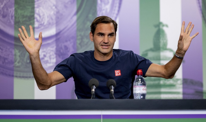 Switzerland&#039;s Roger Federer attends a press conference prior to the Wimbledon Tennis Championships in London, Saturday June 26, 2021. (Florian Eisele/Pool via AP)