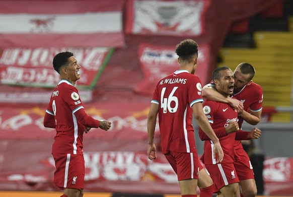 Liverpool&#039;s Thiago, second right, celebrates with teammates after scoring his side&#039;s second goal during the English Premier League soccer match between Liverpool and Southampton at Anfield s ...