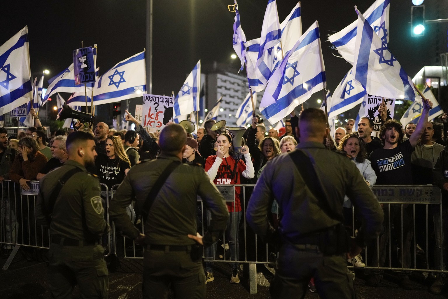 People protest against Israeli Prime Minister Benjamin Netanyahu&#039;s government in Tel Aviv, Israel, Saturday, March 2, 2024. (AP Photo/Leo Correa)