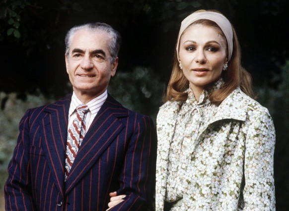 The Shah of Iran Reza Pahlewi and his wife, Empress Farah Diba, pose for photgraphers during a vacation at the villa of King Hassan II in Marrakesh, Morocco, in 1979. Ordinarily, even one of the many  ...