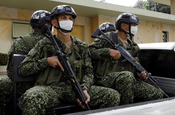 epa08967089 Vehicles with Army soldiers enter the Military Hospital where the lifeless body of Colombian Defense Minister Carlos Holmes Trujillo is found in Bogota, Colombia, 26 January 2021. Colombia ...