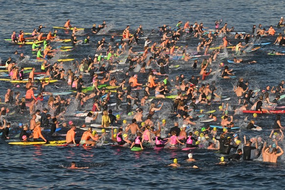 Surfers and swimmers hold a tribute in the sea at Bondi Beach, in Sydney, Friday, Dec. 19, 2025, following last Sunday's shooting. (Mick Tsikas/AAP Image via AP)/AAP Image via AP)
Australia Shoot ...