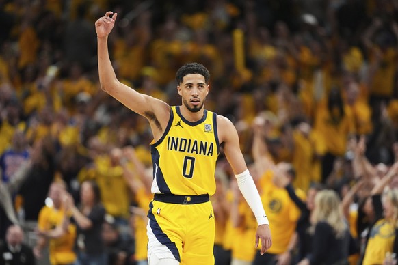 Indiana Pacers guard Tyrese Haliburton (0) celebrates during the second half of Game 6 of the Eastern Conference finals of the NBA basketball playoffs against the New York Knicks in Indianapolis, Satu ...