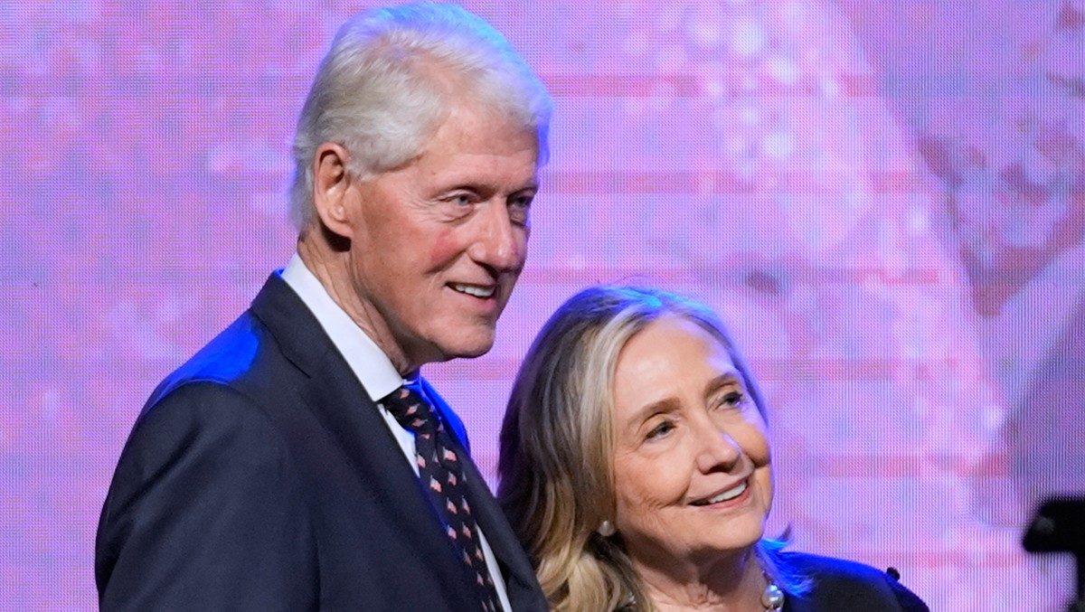 FILE - Former President Bill Clinton, left, and former Secretary of State Hillary Clinton listen as Vice President Kamala Harris delivers a eulogy for U.S. Rep. Sheila Jackson Lee, Aug. 1, 2024, in Ho ...
