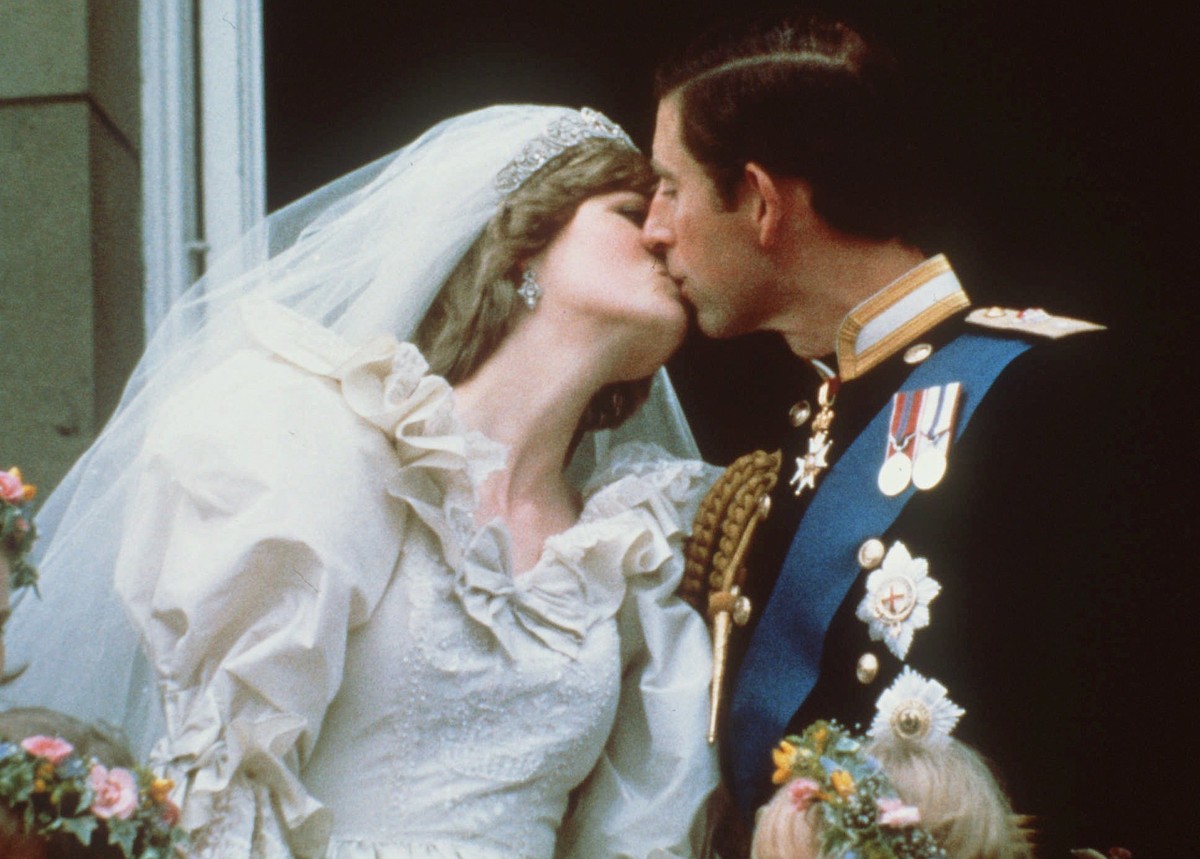 FILE - In this July 29, 1981 file photo, Britain's Prince Charles kisses his bride, the former Diana Spencer, on the balcony of Buckingham Palace in London after their wedding. Thirty-six years a ...