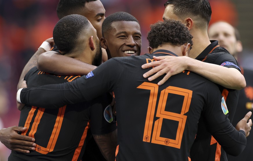 Georginio Wijnaldum of the Netherlands, center, celebrates after scoring his side&#039;s 2nd goal during the Euro 2020 soccer championship group F match between North Macedonia and Netherlands, at the ...