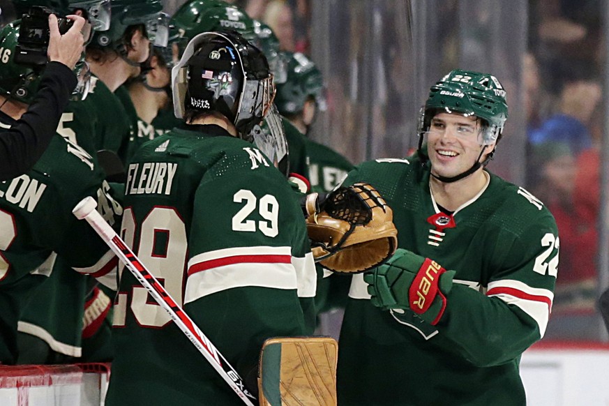 Minnesota Wild left wing Kevin Fiala (22) is congratulated by teammates and Wild goaltender Marc-Andre Fleury (29) in the second period of an NHL hockey game against the Philadelphia Flyers Tuesday, M ...