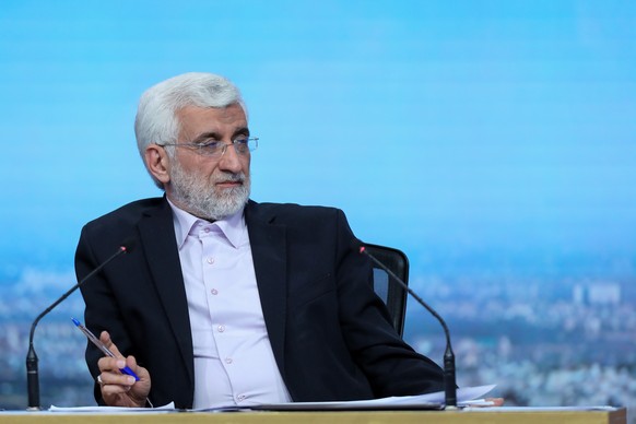 epa11438043 A handout photo made available by the Iranian state TV (IRIB) shows, Iranian presidency candidate Saeed Jalili during a TV debate ahead of the presidential elections, in Tehran, Iran, 25 J ...