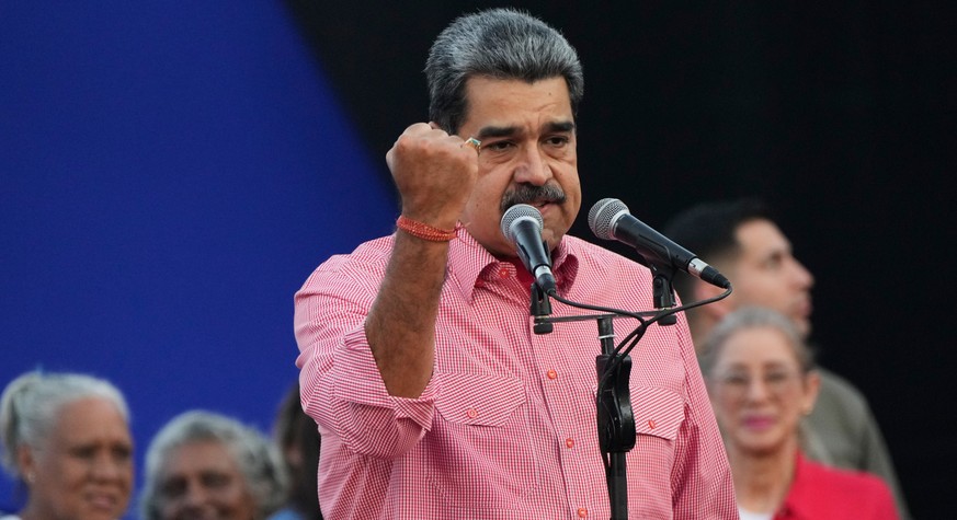 Venezuelan President Nicolas Maduro addresses civilians taking an oath to join a state-organized defense network in the Petare neighborhood of Caracas, Venezuela, Saturday, Nov. 15, 2025. (AP Photo/Ar ...
