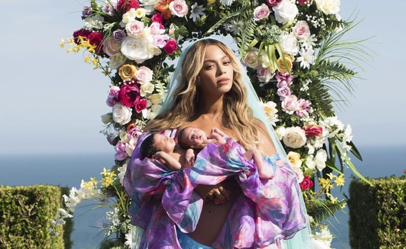 In this undated image released by Parkwood Entertainment on Friday, July 14, 2017, Beyonce posed with her newborn twins Sir Carter and Rumi. The singer posted the picture on Instagram late Thursday ni ...