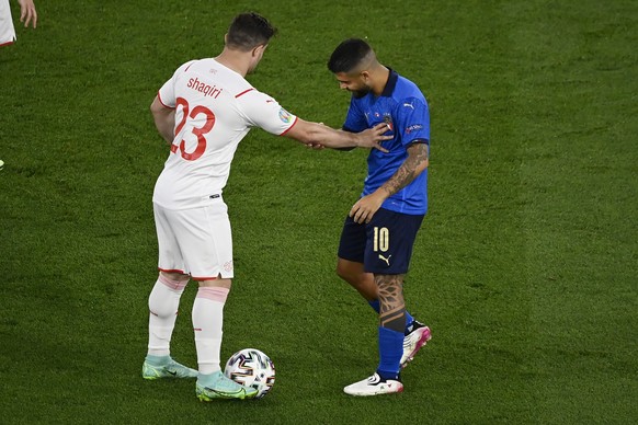 Switzerland&#039;s Xherdan Shaqiri, left, touches Italy&#039;s Lorenzo Insigne during the Euro 2020 soccer championship group A match between Italy and Switzerland at the Rome Olympic stadium, Wednesd ...