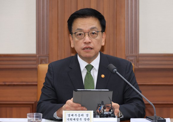 epa12066214 South Finance Minister Choi Sang-mok, who serves concurrently as deputy prime minister for economic affairs, speaks during a meeting of economy-related ministers at the government complex  ...