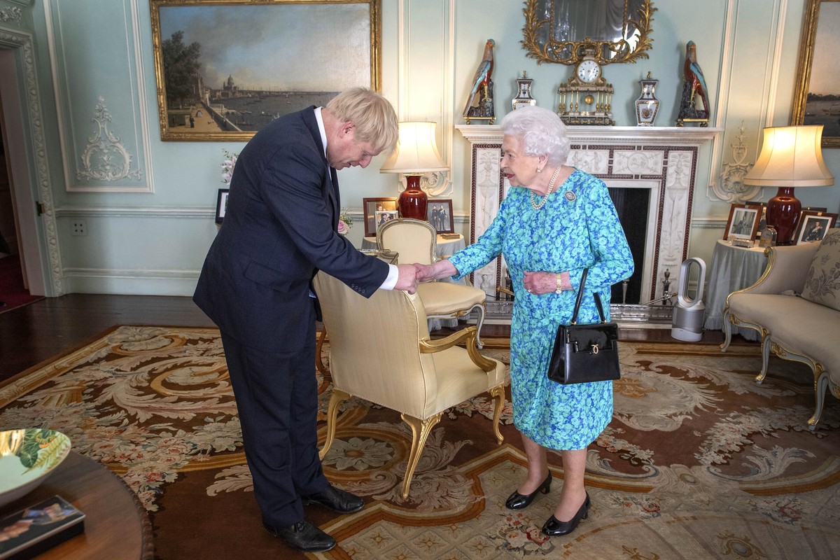 epa07848229 (FILE) - Britain's Queen Elizabeth II welcomes Boris Johnson during an audience where she invited him to become Prime Minister and form a new government, in Buckingham Palace, London, ...