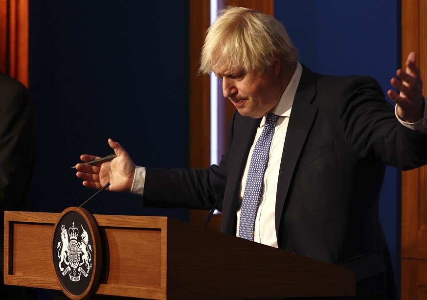 Britain&#039;s Prime Minister Boris Johnson speaks at a press conference in London&#039;s Downing Street, Wednesday Dec. 8, 2021, after ministers met to consider imposing new restrictions in response  ...