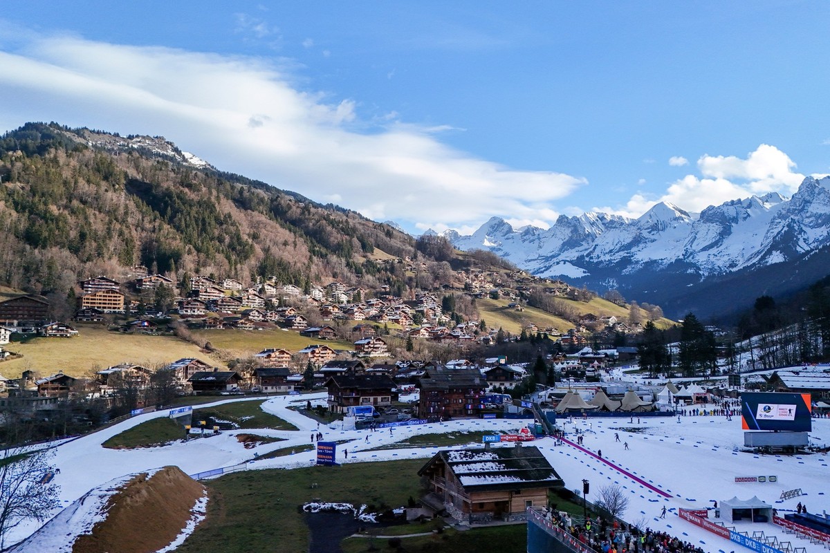 A photograph taken on December 19, 2025 shows an aerial view of competitors training on the route of the men's 10km sprint event of the IBU Biathlon World Cup, in Le Grand Bornand, near Annecy, s ...