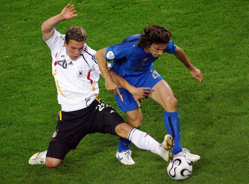 Lukas Podolski (L) from Germany vies with Andrea Pirlo from Italy during the semi final of the 2006 FIFA World Cup between Germany and Italy in Dortmund, Germany, Tuesday, 04 July 2006. EPA/FELIX HEYD ...