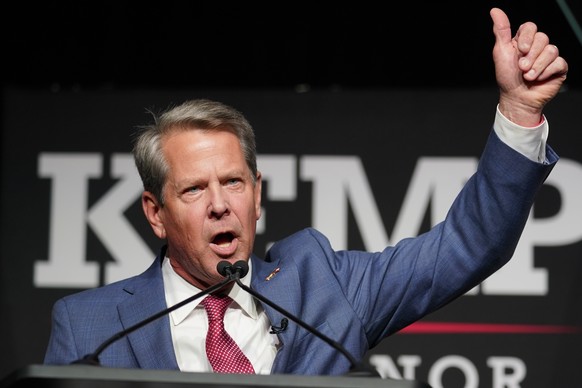 Republican Gov. Brian Kemp waves to supporters during an election night watch party, Tuesday, May 24, 2022, in Atlanta. Kemp easily turned back a GOP primary challenge Tuesday from former U.S. Sen. Da ...