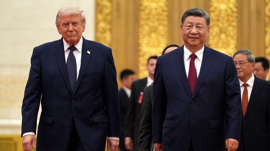 FILE - President Donald Trump, left, and Chinese President Xi Jinping arrive during a state dinner at the Great Hall of the People, May 14, 2026, in Beijing. (AP Photo/Mark Schiefelbein, File)
Trump C ...
