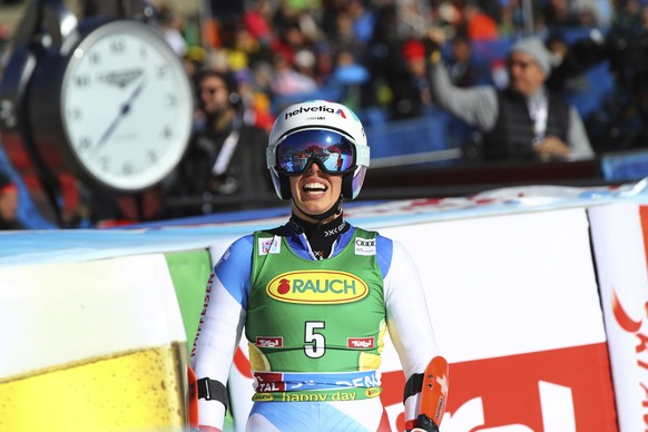 Switzerland's Michelle Gisin smiles at the finish line during an alpine ski, women's World Cup giant slalom, in Soelden, Austria, Saturday, Oct. 23, 2021. (AP Photo/Marco Trovati)