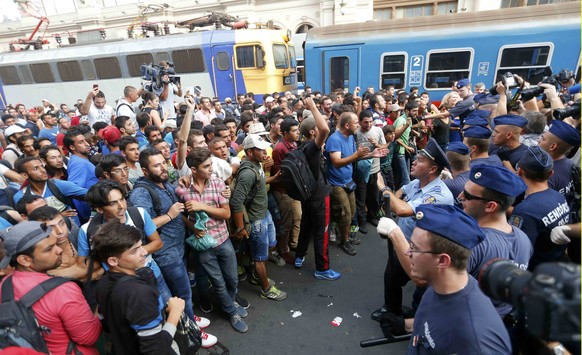 Migrants face Hungarian police in the main Eastern Railway station in Budapest, Hungary, September 1, 2015. Hungary closed Budapest&#039;s main Eastern Railway station on Tuesday morning with no train ...