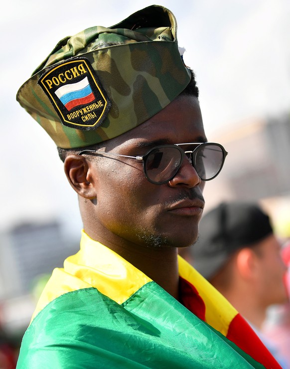 epa06820891 A Senegalese supporter arrives for the FIFA World Cup 2018 group H preliminary round soccer match between Poland and Senegal in Moscow, Russia, 19 June 2018. EPA/BARTLOMIEJ ZBOROWSKI POLAN ...