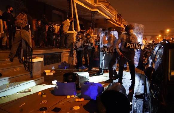 People gather in protest in response to the police shooting of Walter Wallace Jr., Monday, Oct. 26, 2020, in Philadelphia. Police officers fatally shot the 27-year-old Black man during a confrontation ...