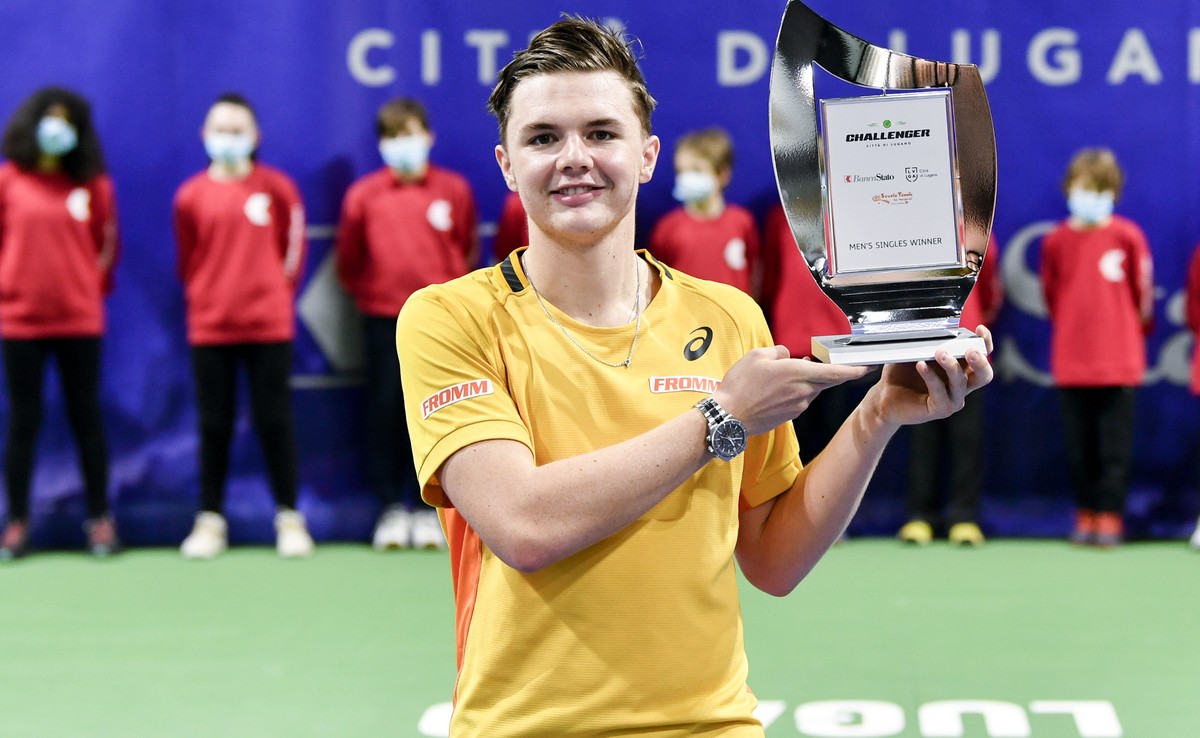 epa09103182 Switzerland's Dominic Stricker poses with the trophy after winning the final match against Ukraine's Vitaliy Sachko at the ATP Challenger tournament Lugano in Lugano, Switzerland ...