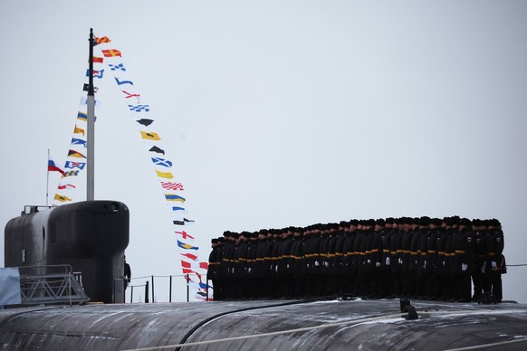 Russia Putin North Western Federal District 8579754 11.12.2023 Russian sailors line up aboard the Emperor Alexander III nuclear submarine during a ceremony to raise the navy s flag at the Sevmash Ship ...
