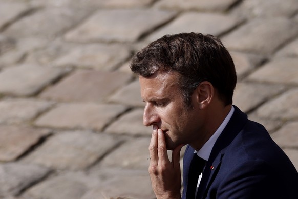 epa09912572 French President Emmanuel Macron attends a national homage to late French actor Michel Bouquet at Les Invalides monument in Paris, France, 27 April 2022. French stage and film actor Michel ...