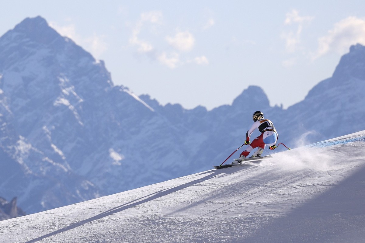 Switzerland's Lara Gut Behrami speeds down the course during an alpine ski, women's World Cup downhill training, in Cortina d'Ampezzo, Italy, Friday, Jan. 21, 2022. (AP Photo/Alessandro ...