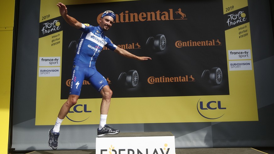 epa07703819 France&#039;s Julian Alaphilippe of Deceuninck Quick Step team celebrates his win on the podium following the 3rd stage of the 106th edition of the Tour de France cycling race over 215km b ...