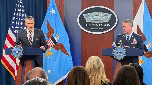 Defense Secretary Pete Hegseth and Chairman of the Joint Chiefs of Staff Gen. Dan Caine, speak during a press briefing at the Pentagon, Wednesday, March 4, 2026, in Washington. (AP Photo/Konstantin To ...
