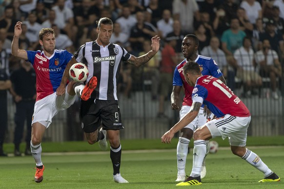 Basel&#039;s Fabian Frei, left, fights for the ball against PAOK&#039;s Aleksandar Prijovic during the UEFA Champions League second qualifying round first leg match between Greece&#039;s PAOK FC and S ...