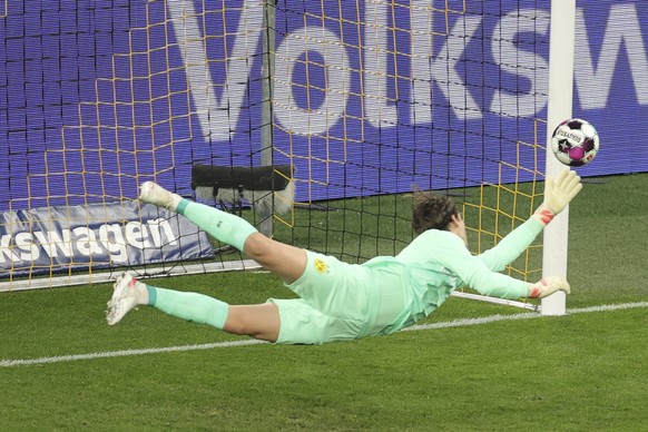 Dortmund&#039;s goalkeeper Marwin Hitz makes a save during the German Soccer Cup semifinal match between Borussia Dortmund and Holstein Kiel in Dortmund, Germany, Saturday, May 1, 2021. (Friedemann Vo ...