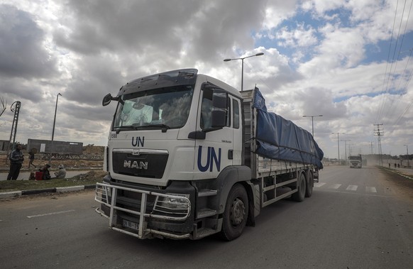 epa11207283 Trucks carrying aid to Gaza residents cross from Rafah border to Deir Al Balah town, southern Gaza Strip, 08 March 2024. Since 07 October 2023, up to 1.9 million people, or more than 85 pe ...