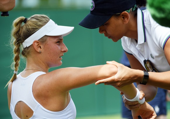 epa07697216 Dayana Yastremska of Ukraine receives treatment as she plays Viktorija Golubic of Switzerland in their third round match during the Wimbledon Championships at the All England Lawn Tennis C ...