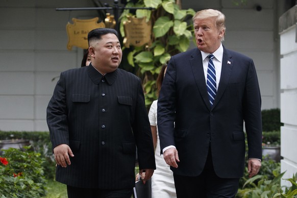 President Donald Trump and North Korean leader Kim Jong Un take a walk after their first meeting at the Sofitel Legend Metropole Hanoi hotel, Thursday, Feb. 28, 2019, in Hanoi. (AP Photo/Evan Vucci)