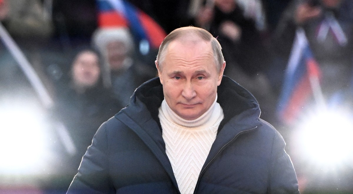 epa09833831 Russian President Vladimir Putin attends a concert marking the 8th anniversary of Crimea's reunification with Russia at the Luzhniki stadium in Moscow, Russia, 18 March 2022. Russia i ...