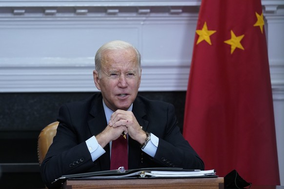 FILE - President Joe Biden speaks as he meets virtually with Chinese President Xi Jinping from the Roosevelt Room of the White House in Washington, Nov. 15, 2021. Biden is ready to urge participants a ...