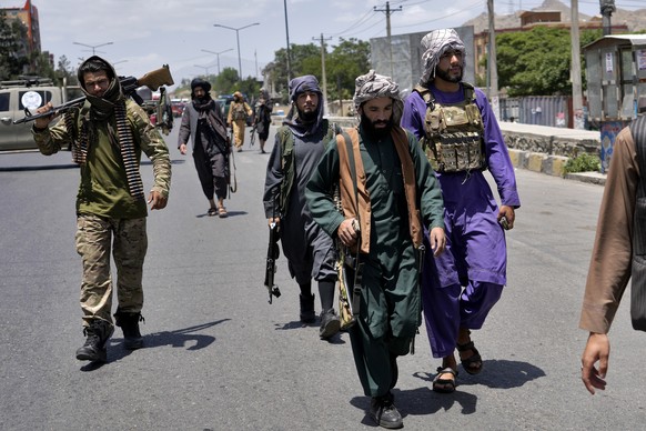 Taliban fighters guard at the site of an explosion in Kabul, Afghanistan, Saturday, June 18, 2022. Several explosions and gunfire ripped through a Sikh temple in Afghanistan&#039;s capital. (AP Photo/ ...