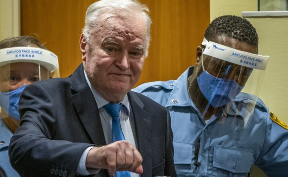 Former Bosnian Serb military chief Ratko Mladic enters the court room in The Hague, Netherlands, Tuesday, June 8, 2021, where the United Nations court delivers its verdict in the appeal of Mladic agai ...
