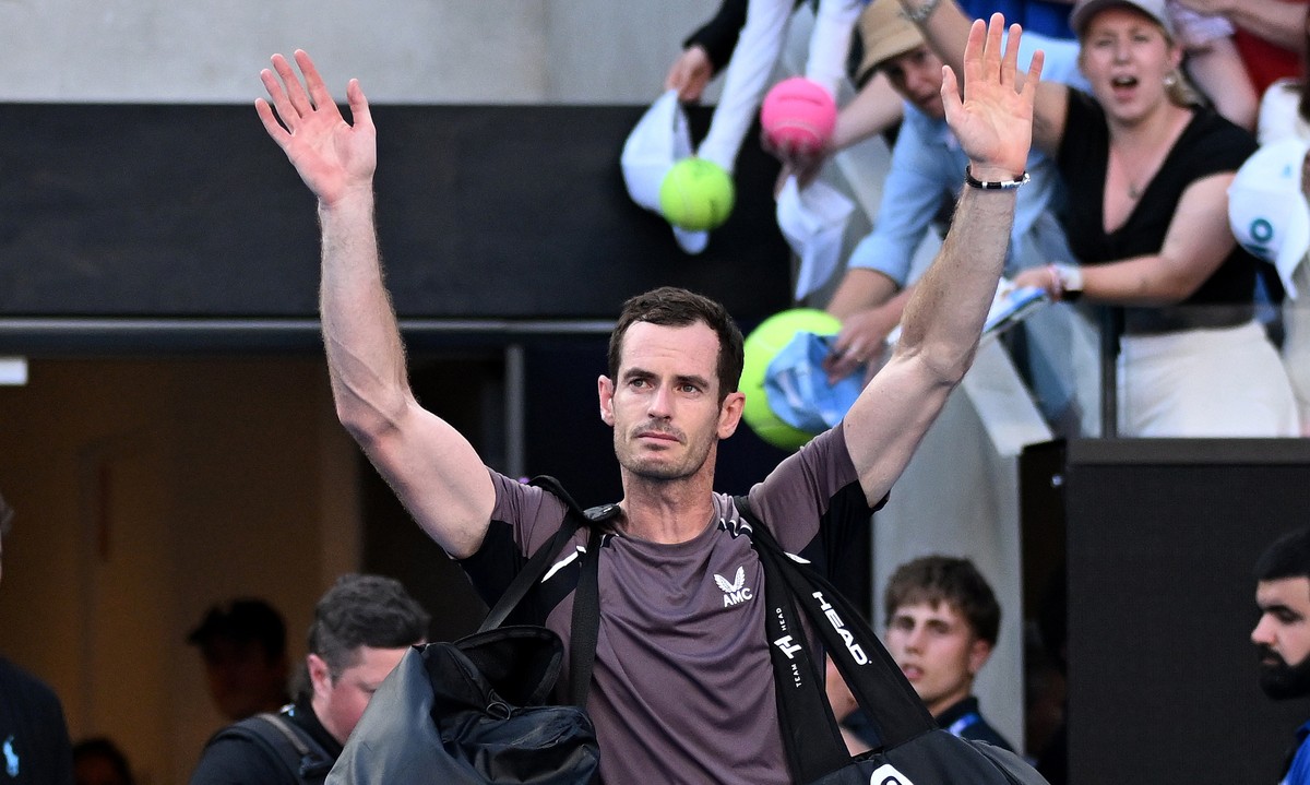 epa11078852 Andy Murray of Great Britain waves to the crowd as he exits the court following his first round loss to Tomas Martin Etcheverry of Argentina on Day 2 of the 2024 Australian Open at Melbour ...