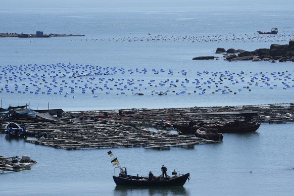 A boat moves through the water at the 68-nautical-mile scenic spot, the closest point in mainland China to the island of Taiwan, in Pingtan in southeastern China&#039;s Fujian Province, Friday, Aug. 5 ...