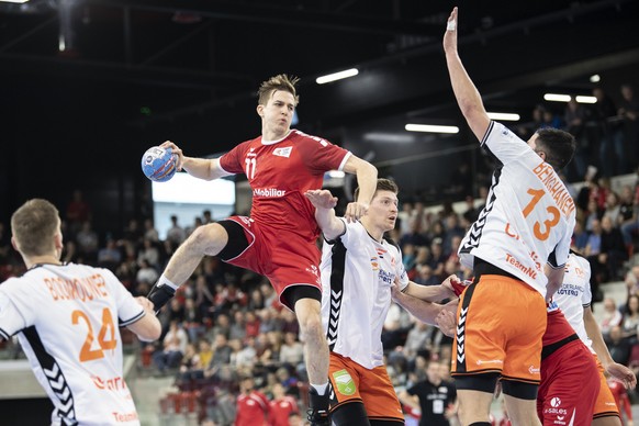 Switzerland&#039;s Roman Sidorowicz, left, in action against Netherlands&#039; Samir Benghanem, right, during the Yellow Cup Handball game between Switzerland and Netherlands in Switzerland, Winterthu ...