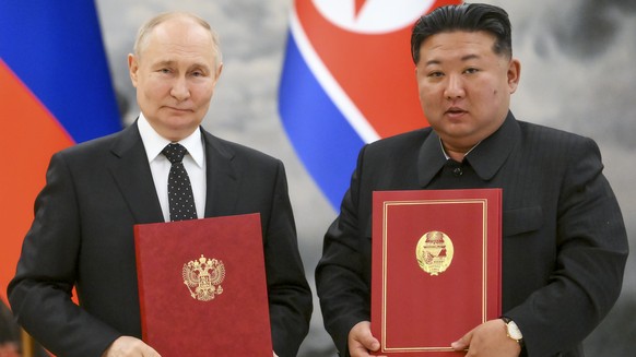 FILE - Russian President Vladimir Putin, left, and North Korea&#039;s leader Kim Jong Un pose for a photo during a signing ceremony of a new partnership in Pyongyang, North Korea, June 19, 2024. (Kris ...