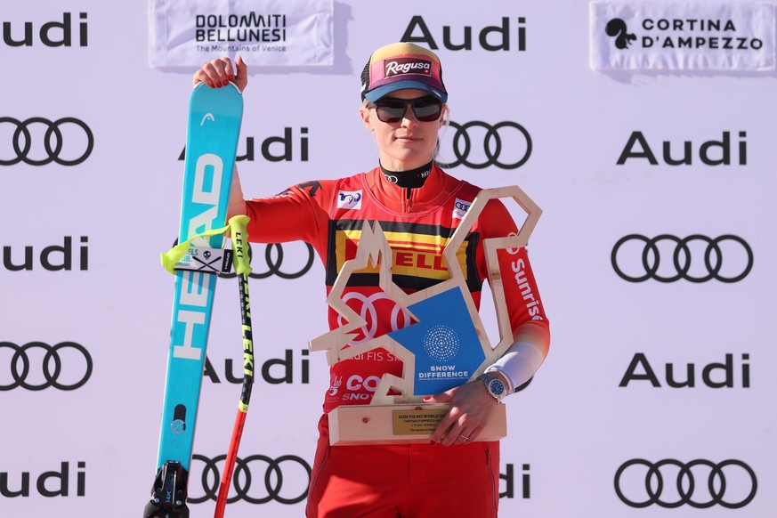 epa11110425 Winner Lara Gut-Behrami of Switzerland celebrates on the podium after the Women's SuperG race at the FIS Alpine Skiing World Cup in Cortina d'Ampezzo, Italy, 28 January 2024. EPA ...