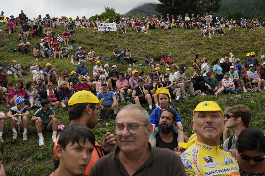 Spectators wait at the finish line during the fifth stage of the Tour de France cycling race over 163 kilometers (101 miles) with start in Pau and finish in Laruns, France, Wednesday, July 5, 2023. (A ...
