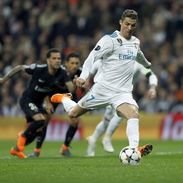 Real Madrid&#039;s Cristiano Ronaldo scores his side&#039;s first goal from the penalty spot during a Champions League Round of 16 first leg soccer match between Real Madrid and Paris Saint Germain at ...