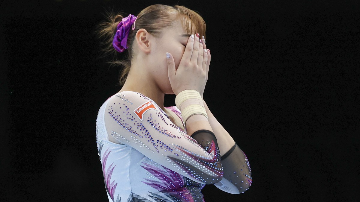 Japan's Shoko Miyata reacts after falling on the floor exercise during the women's team final at the Artistic Gymnastics World Championships in Antwerp, Belgium, Wednesday, Oct. 4, 2023. (AP ...